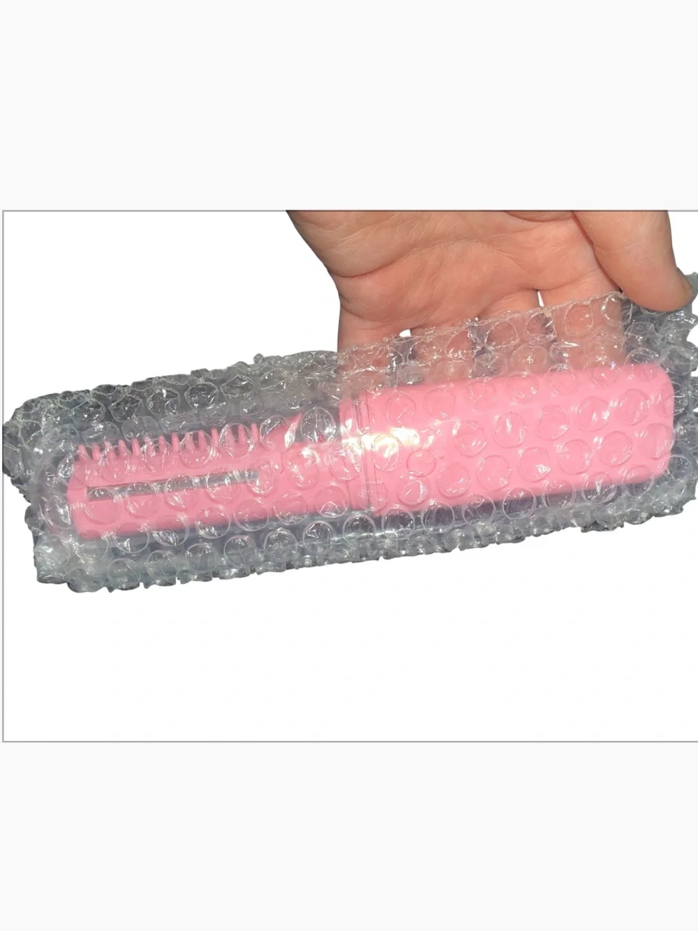 Vintage pink, portable battery-operated cordless hair curler and styling brush d